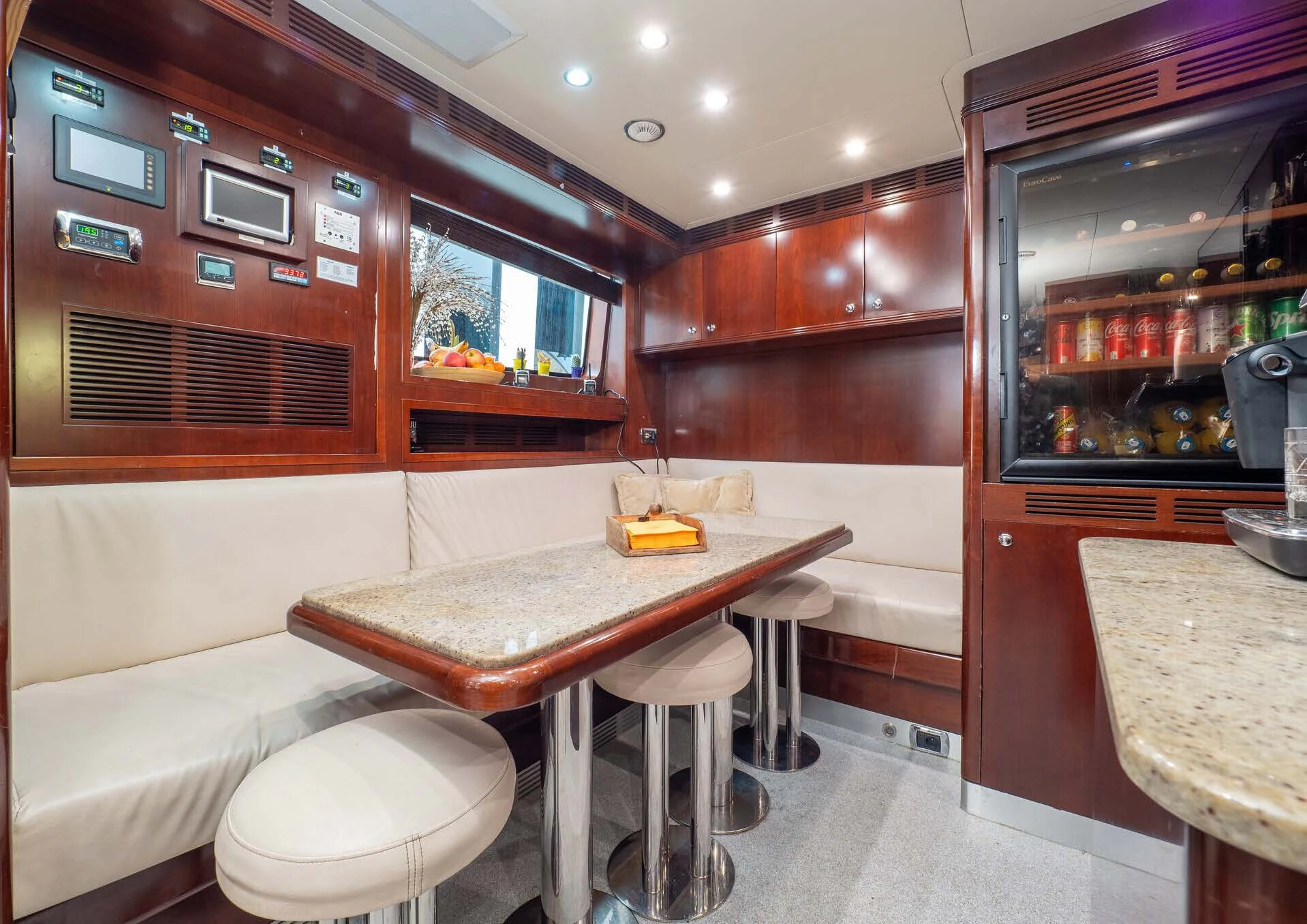 a kitchen with a table and chairs aboard GIORGIA I Yacht for Sale