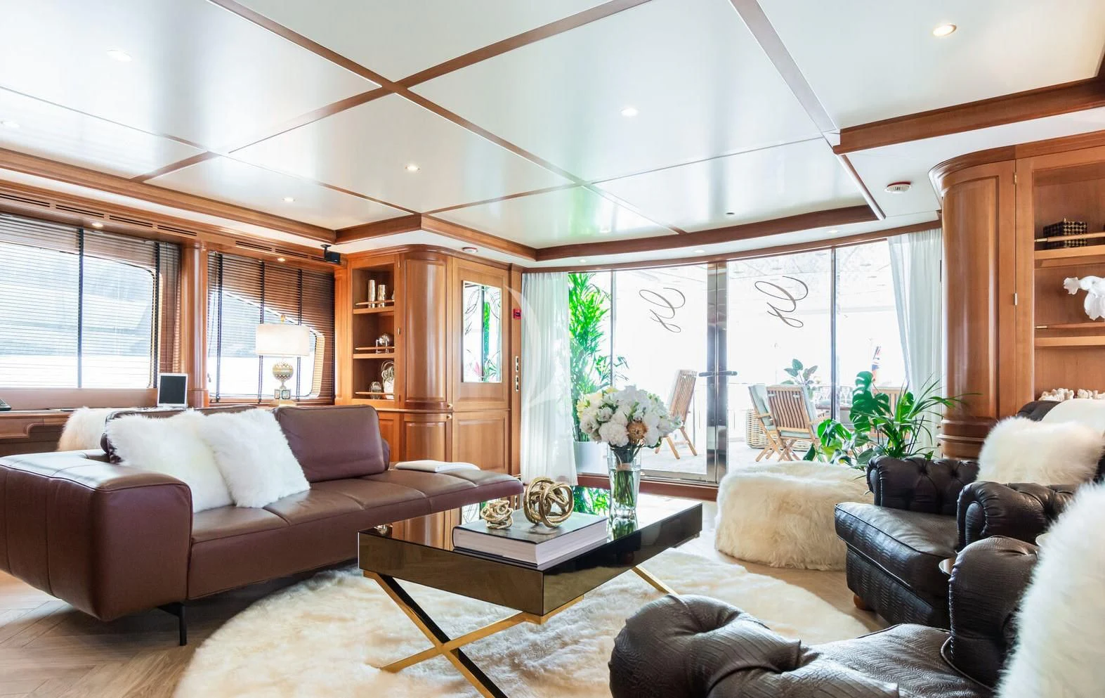a living room with a large window aboard GIORGIA I Yacht for Sale