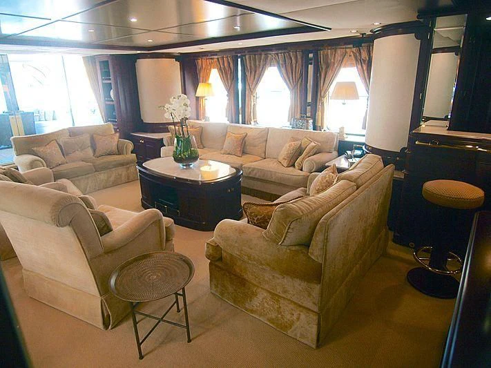 a living room with a couch and a table aboard GIORGIA I Yacht for Sale