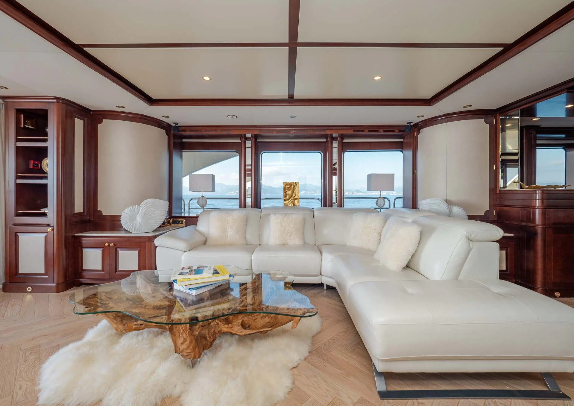 a living room with a couch and a coffee table aboard GIORGIA I Yacht for Sale