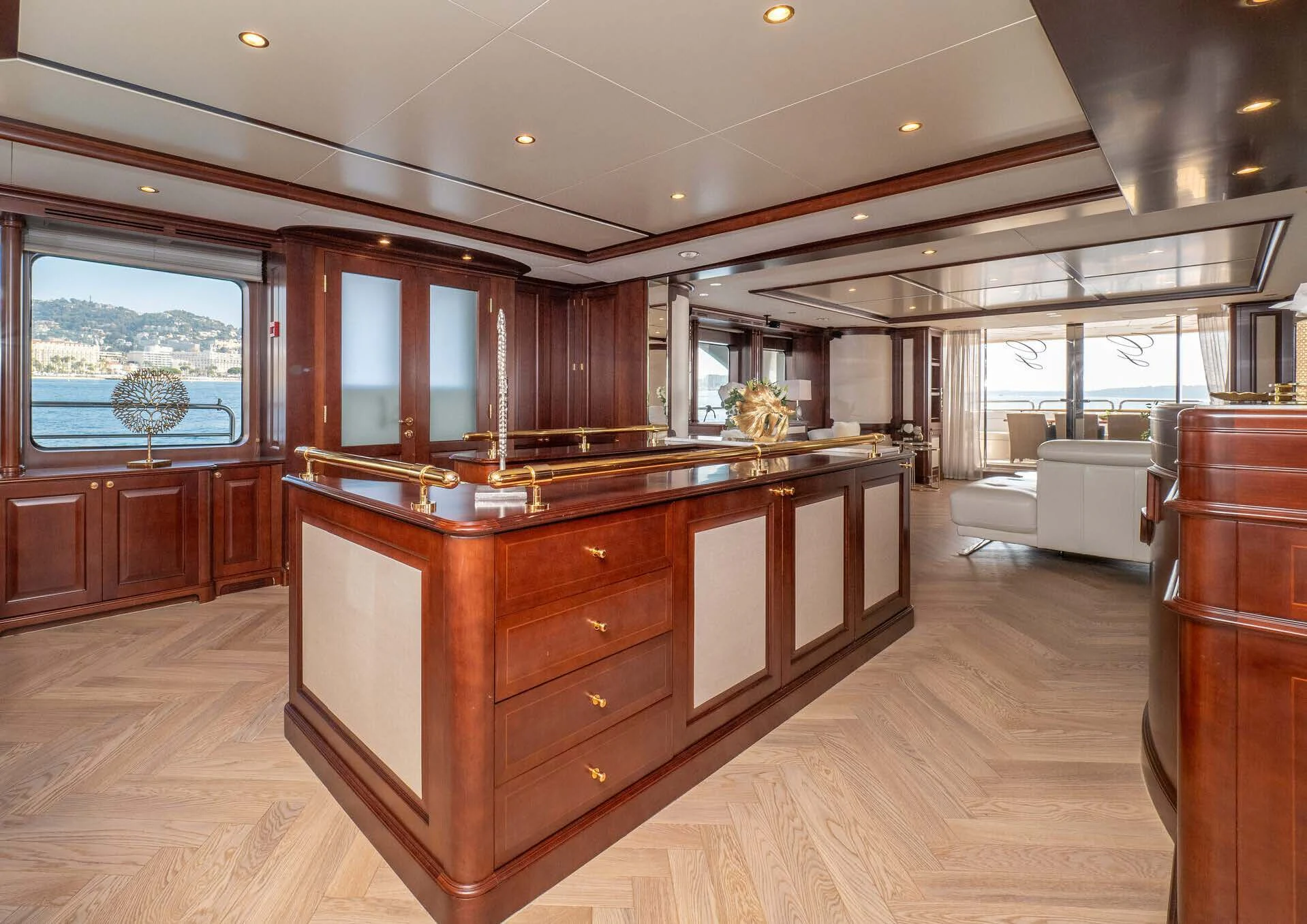 a large kitchen with wooden cabinets aboard GIORGIA I Yacht for Sale