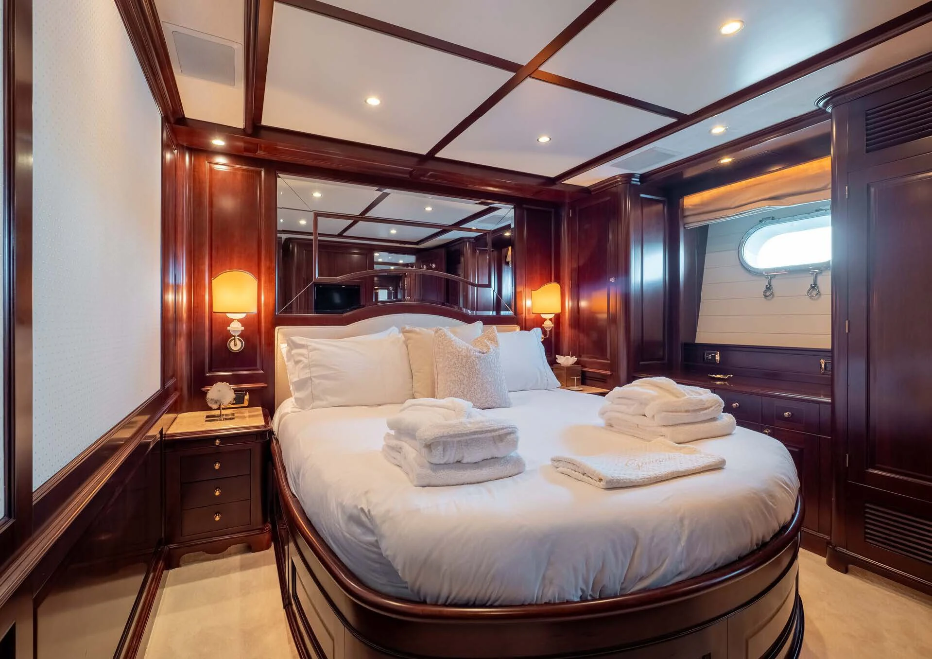 a bed with a white bed aboard GIORGIA I Yacht for Sale