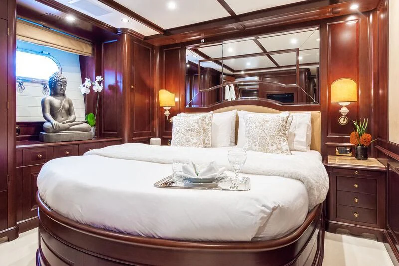 a bed with a white sheet and pillows aboard GIORGIA I Yacht for Sale