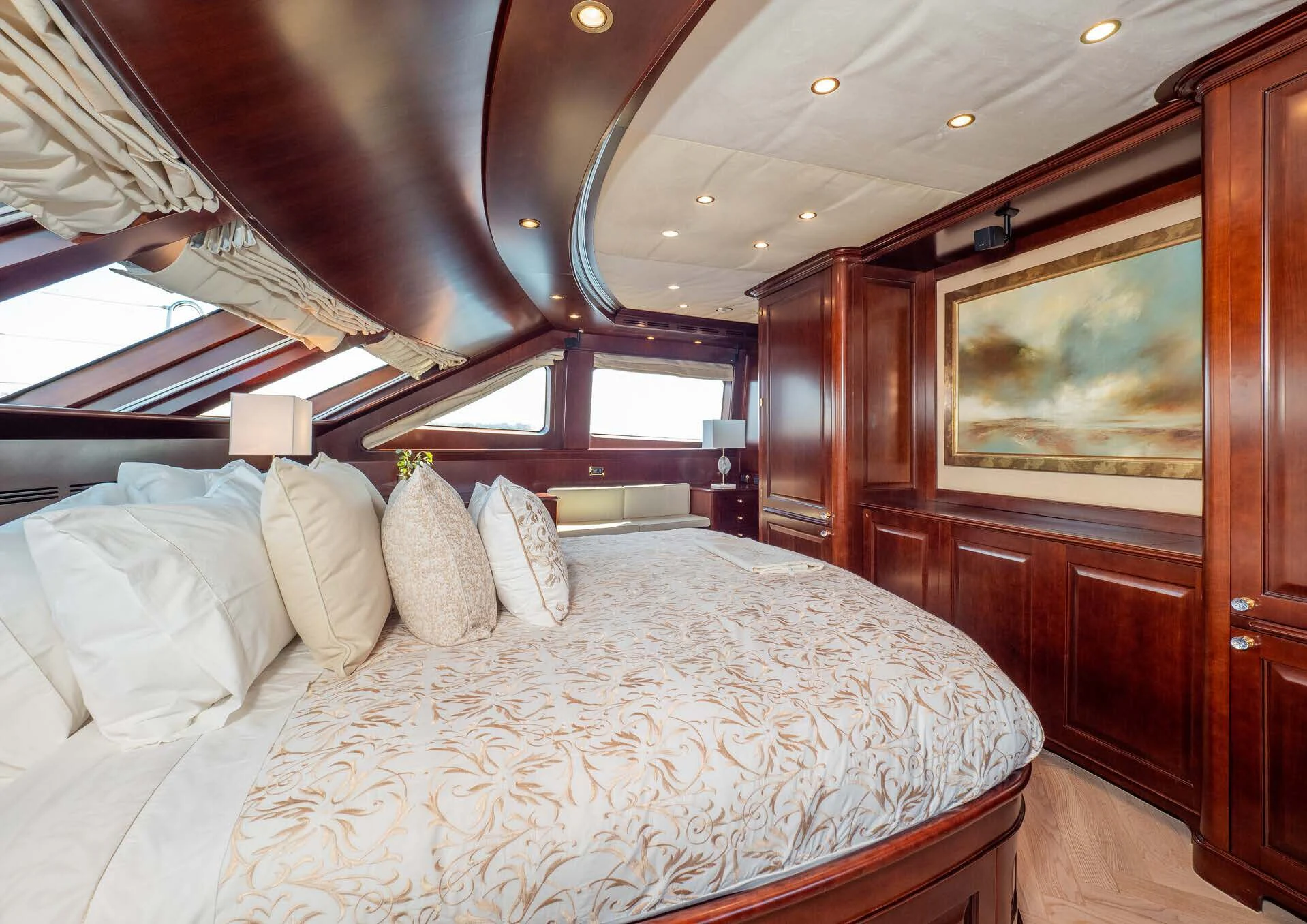 a bed with pillows and a mirror aboard GIORGIA I Yacht for Sale