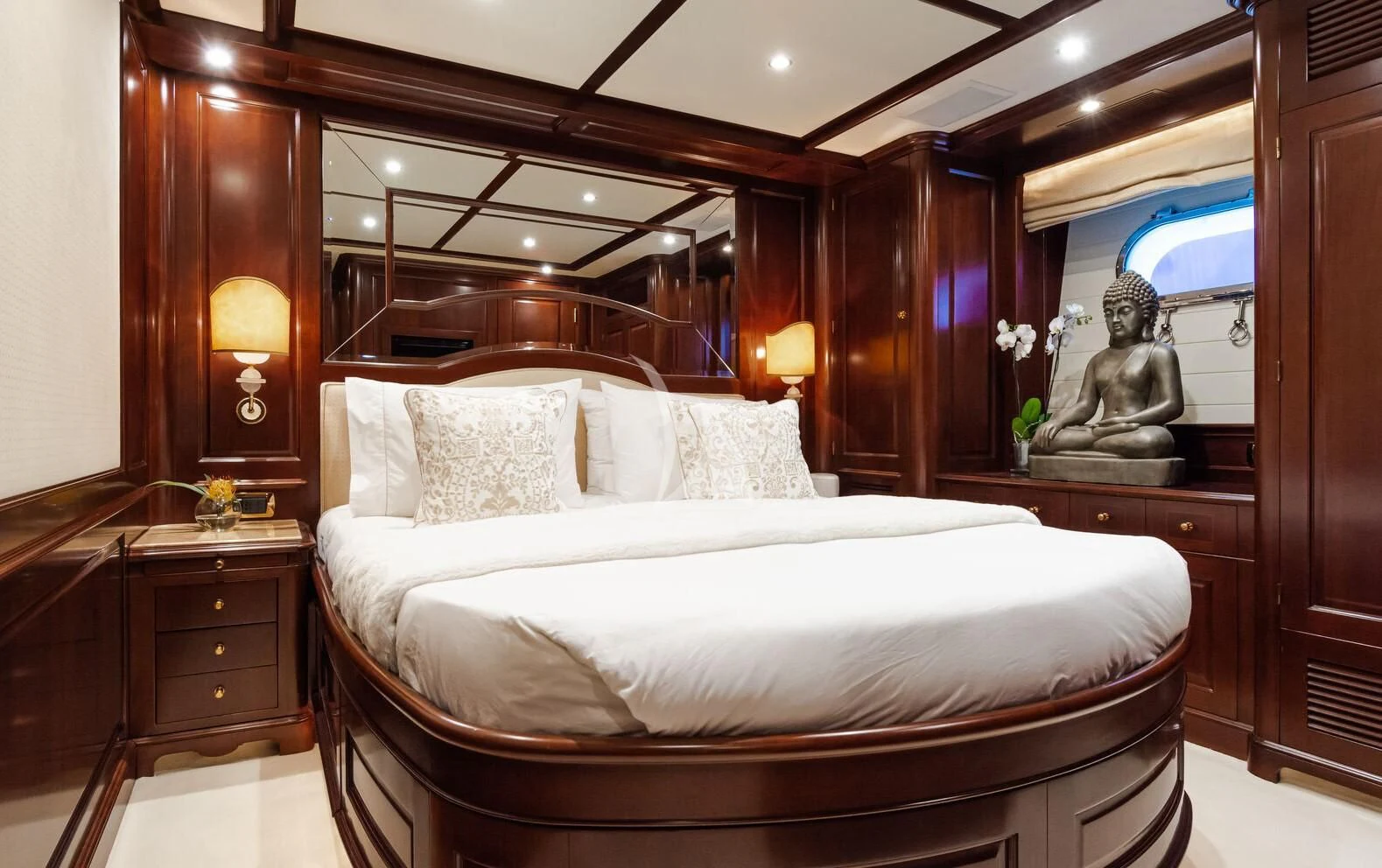a bed with a mirror above it aboard GIORGIA I Yacht for Sale