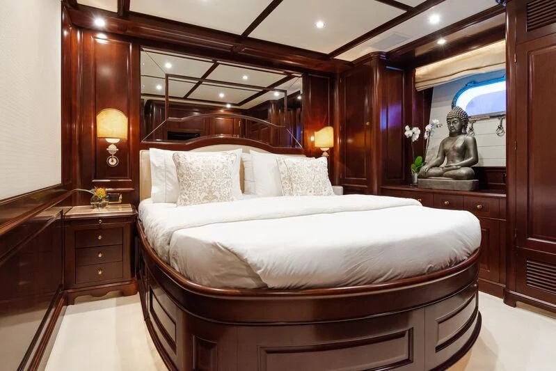 a bed with a mirror above it aboard GIORGIA I Yacht for Sale