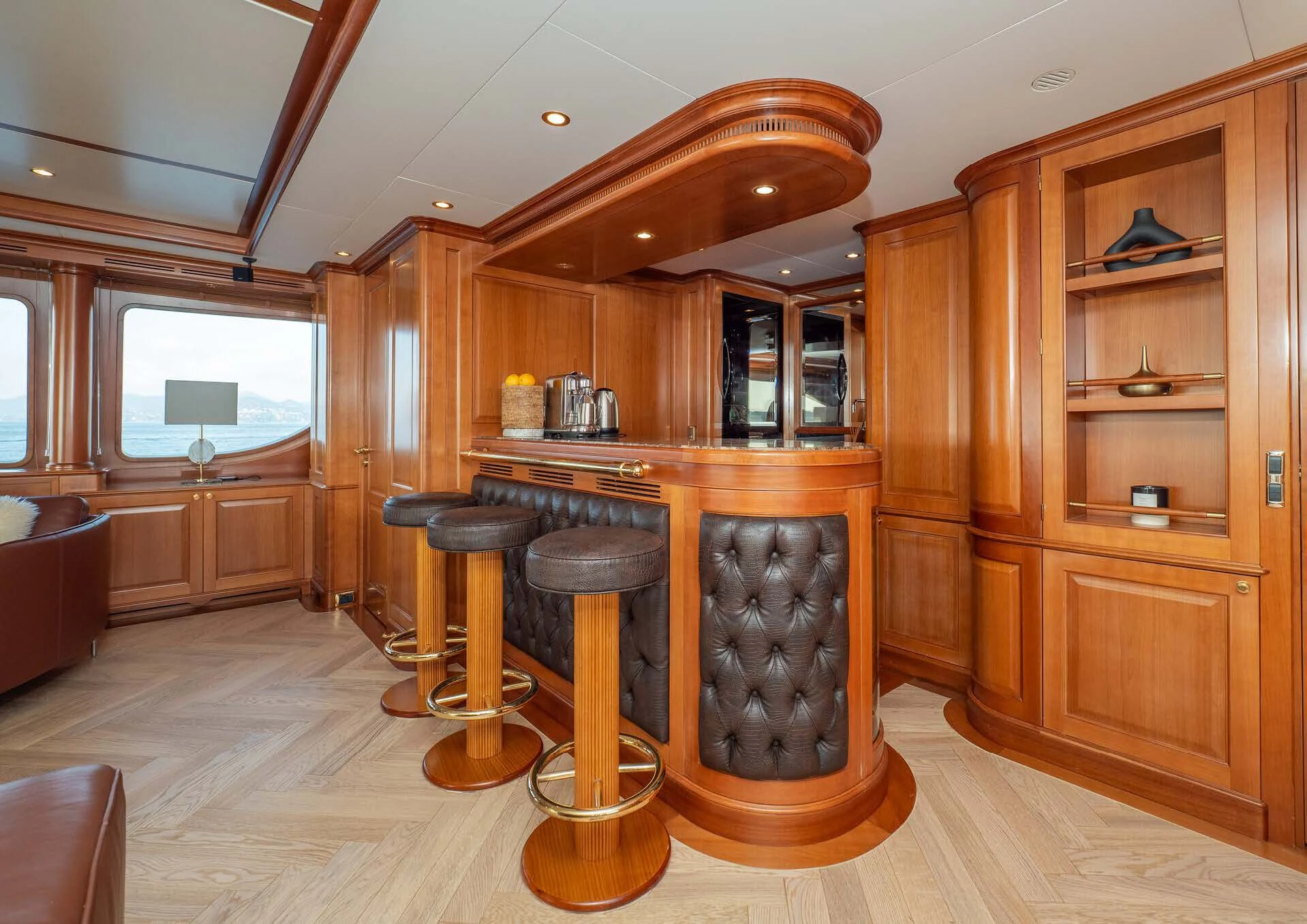 a kitchen with a wood cabinet aboard GIORGIA I Yacht for Sale