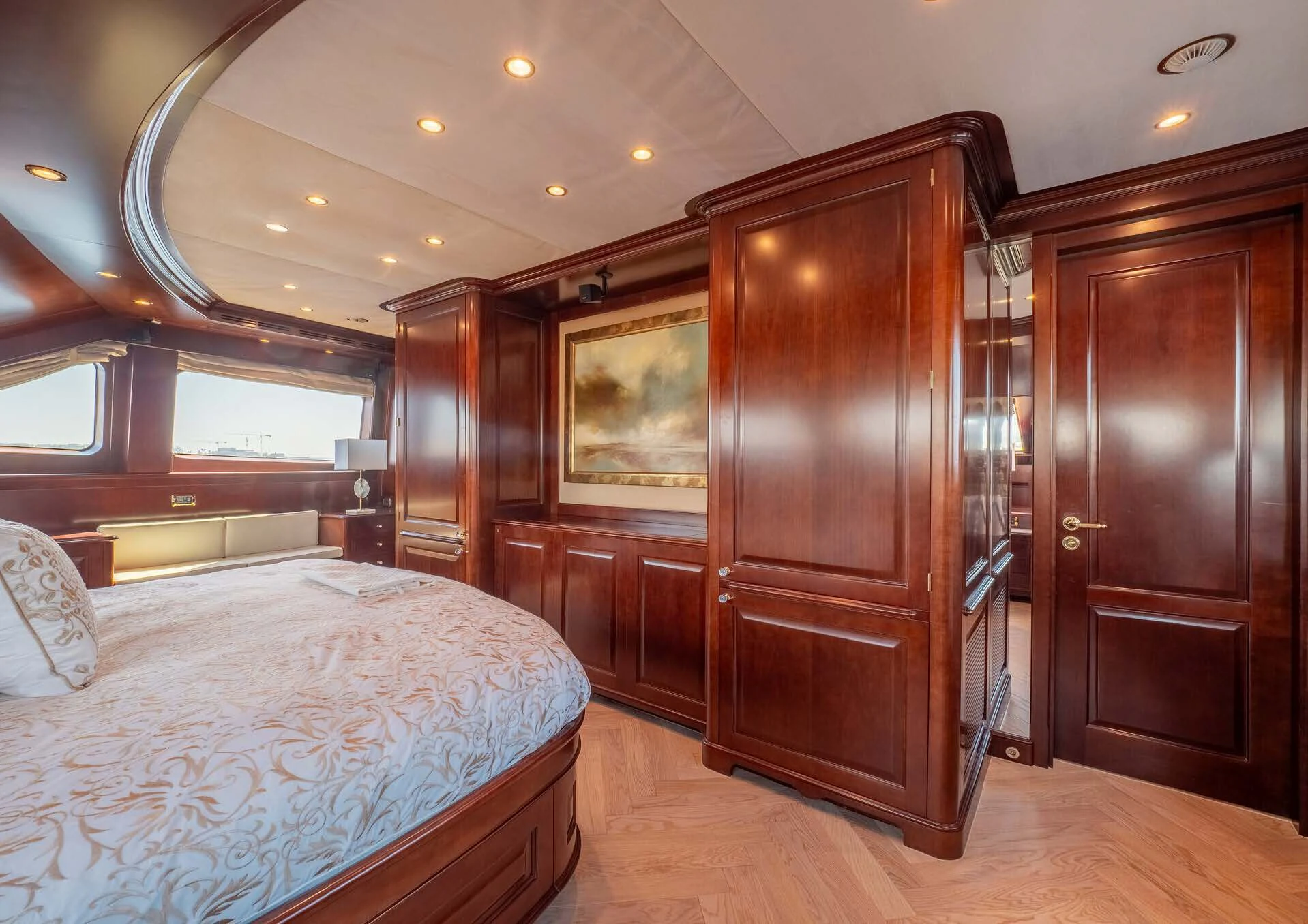 a bedroom with a bed and a closet aboard GIORGIA I Yacht for Sale
