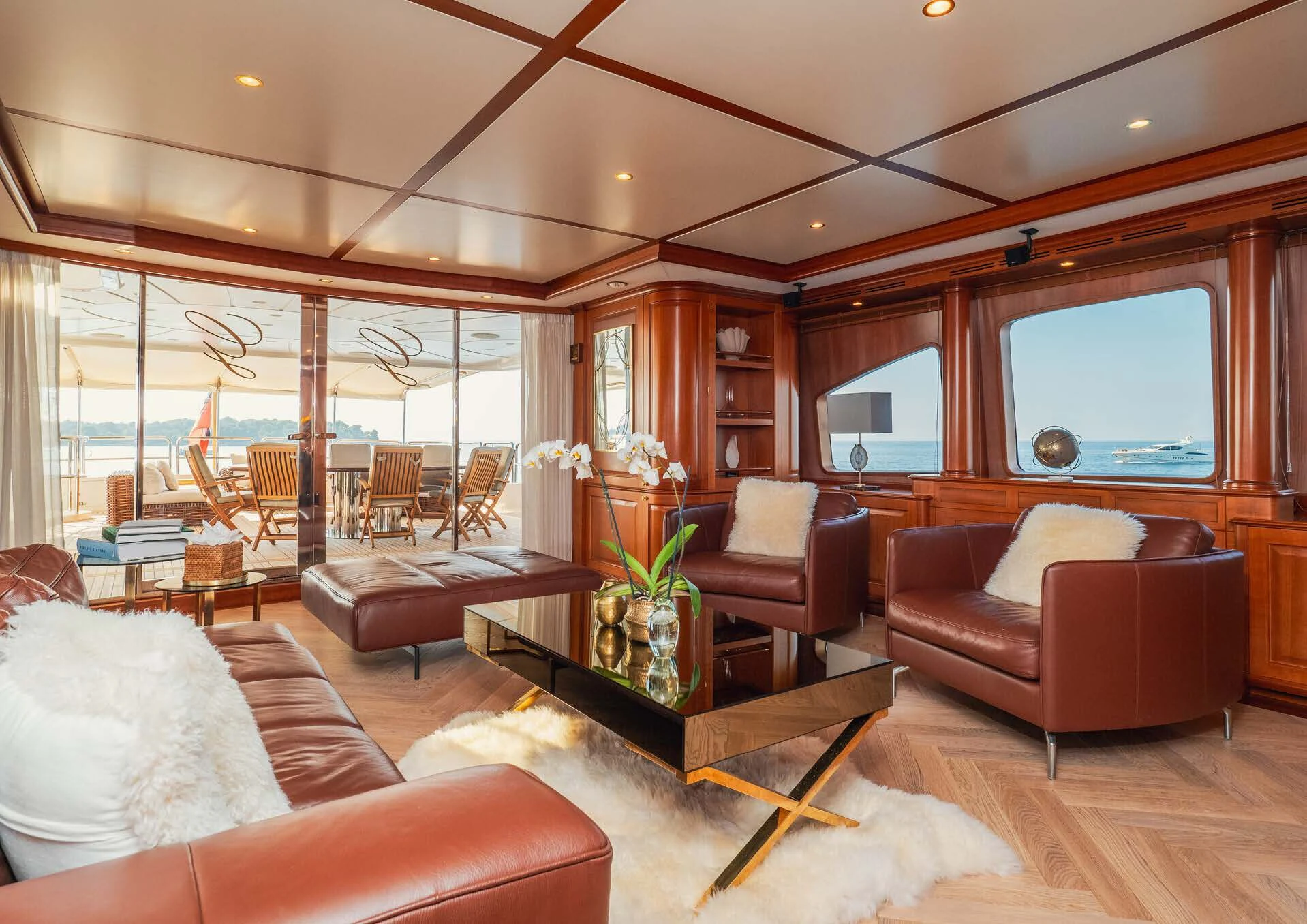 a living room with a large window aboard GIORGIA I Yacht for Sale