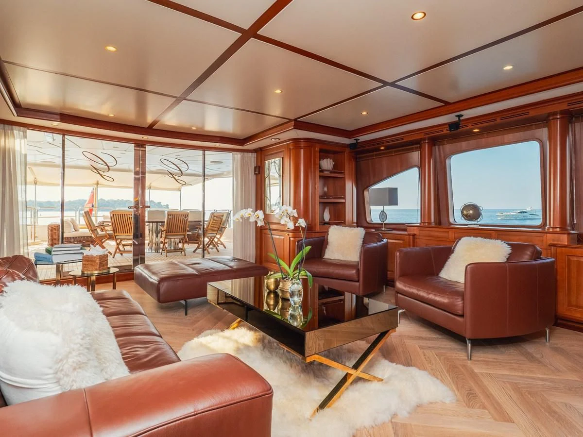 a living room with a large window aboard GIORGIA I Yacht for Sale