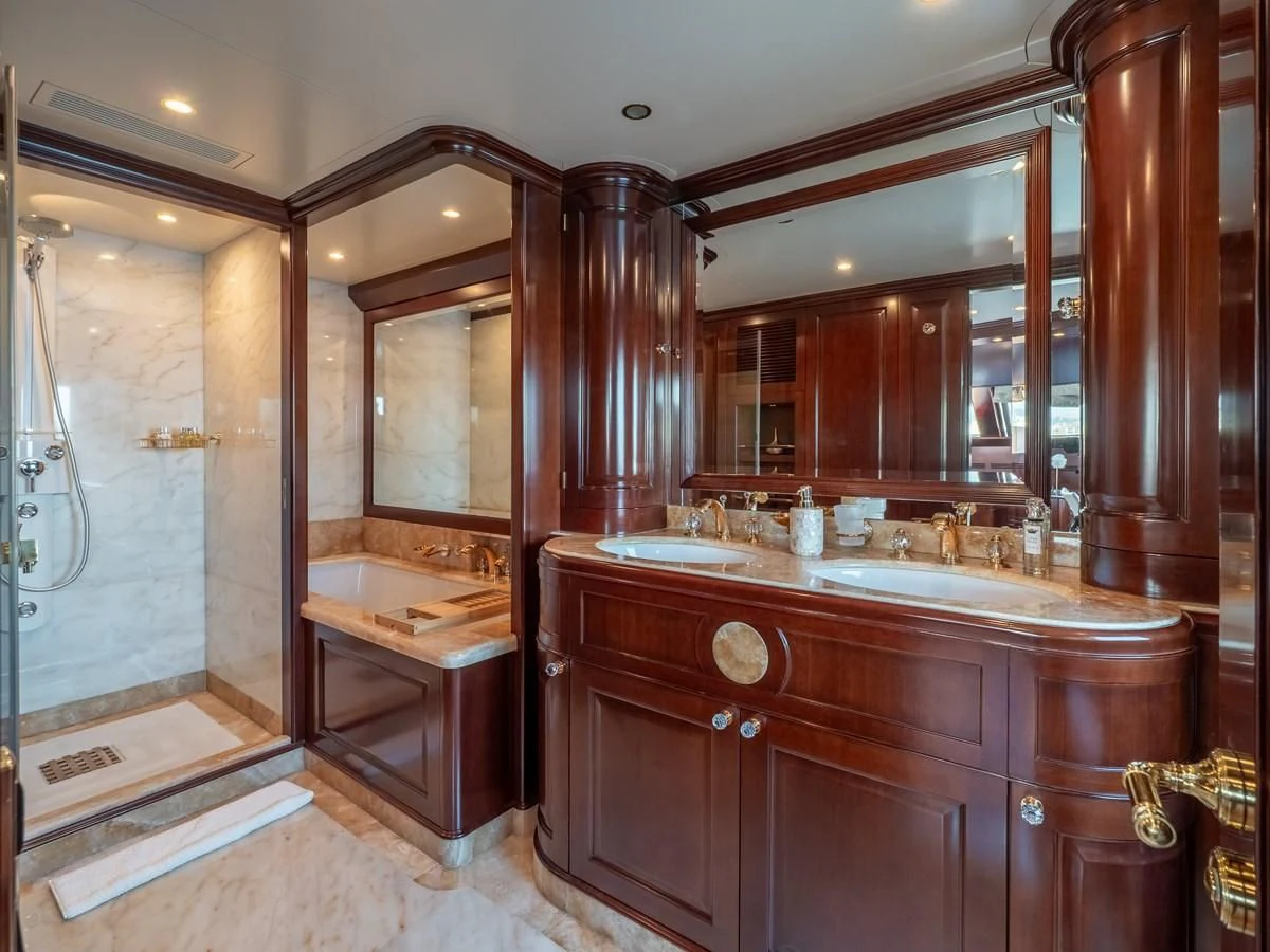 a bathroom with a large mirror aboard GIORGIA I Yacht for Sale