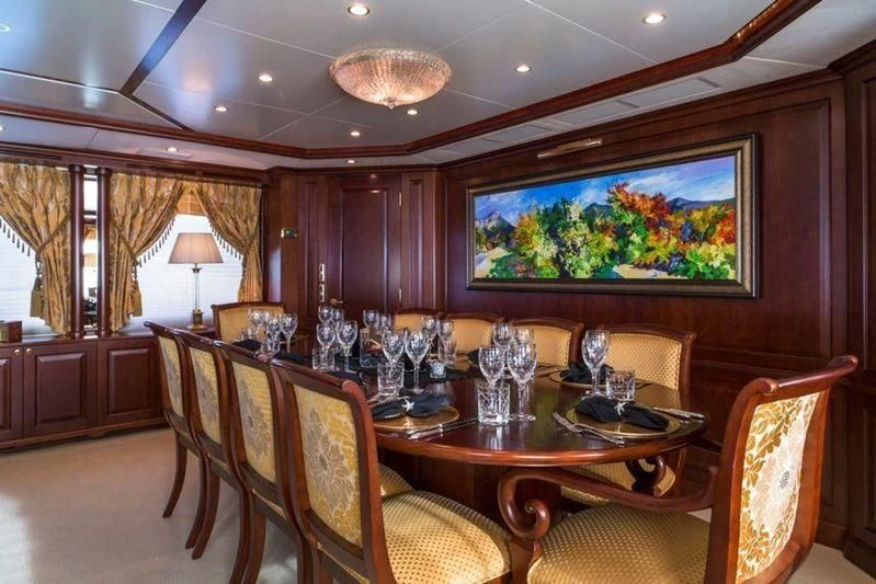 a dining room with a table and chairs aboard GIORGIA I Yacht for Sale