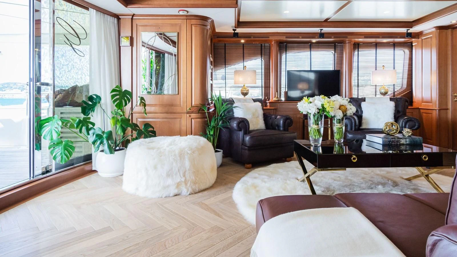 a living room with a large window aboard GIORGIA I Yacht for Sale