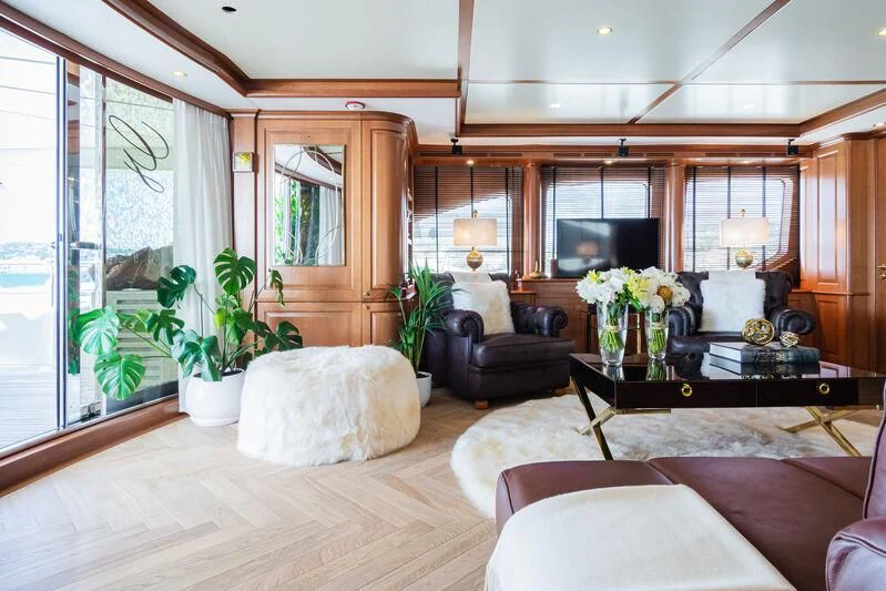 a living room with a large window aboard GIORGIA I Yacht for Sale