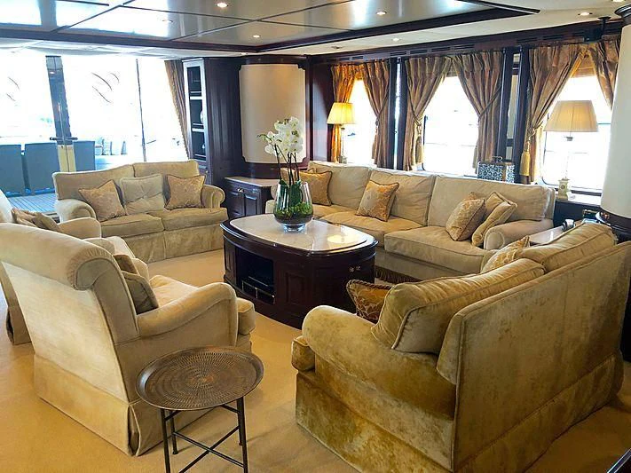 a living room with a couch and a coffee table aboard GIORGIA I Yacht for Sale