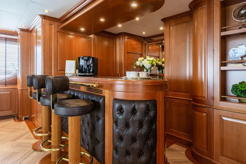 a kitchen with a bar stool aboard GIORGIA I Yacht for Sale