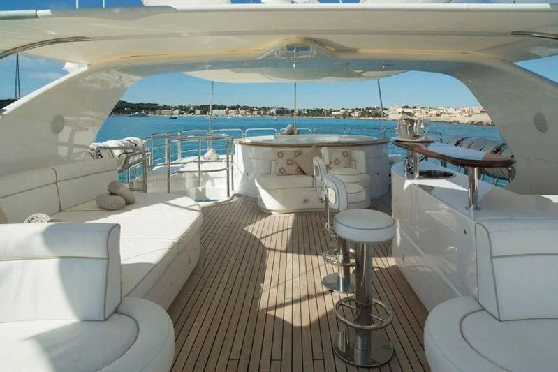 a room with a large deck and a large pool aboard GIORGIA I Yacht for Sale