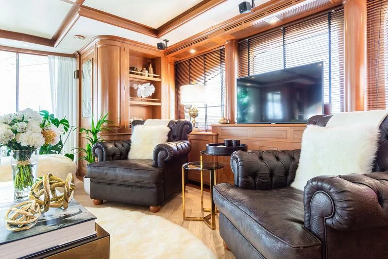 a living room with leather couches aboard GIORGIA I Yacht for Sale