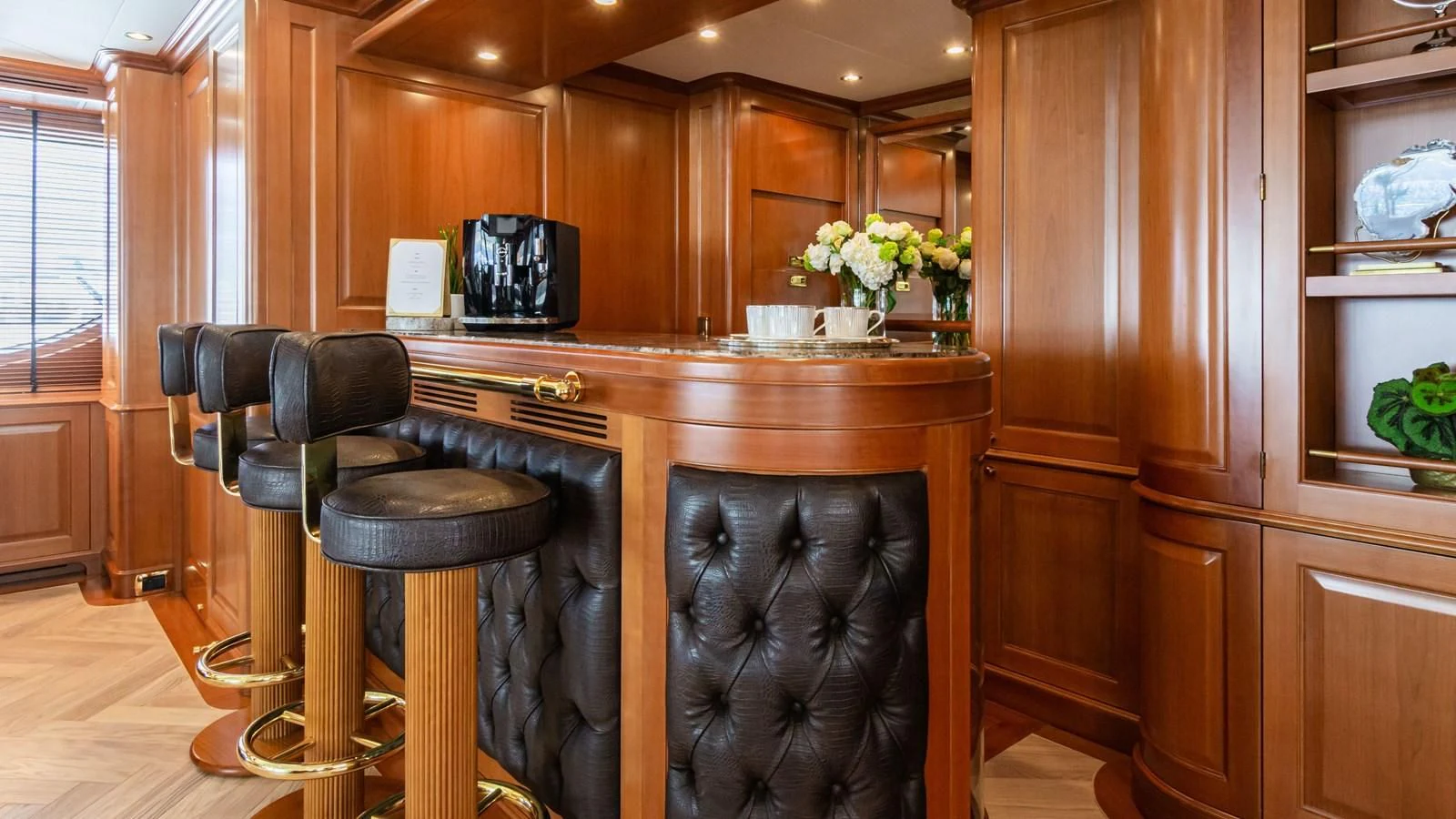 a kitchen with a bar stool aboard GIORGIA I Yacht for Sale