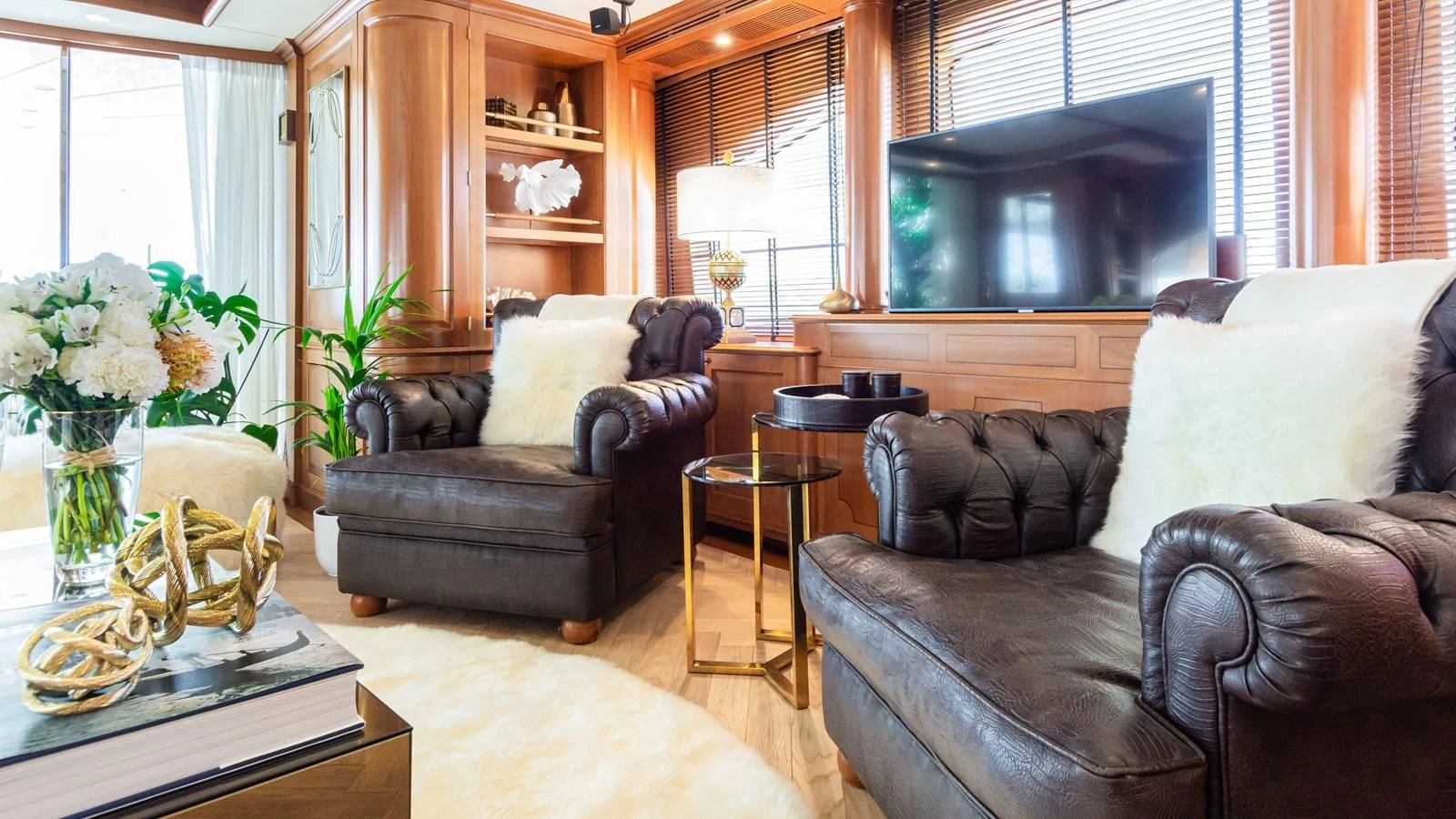 a living room with a couch and a television aboard GIORGIA I Yacht for Sale