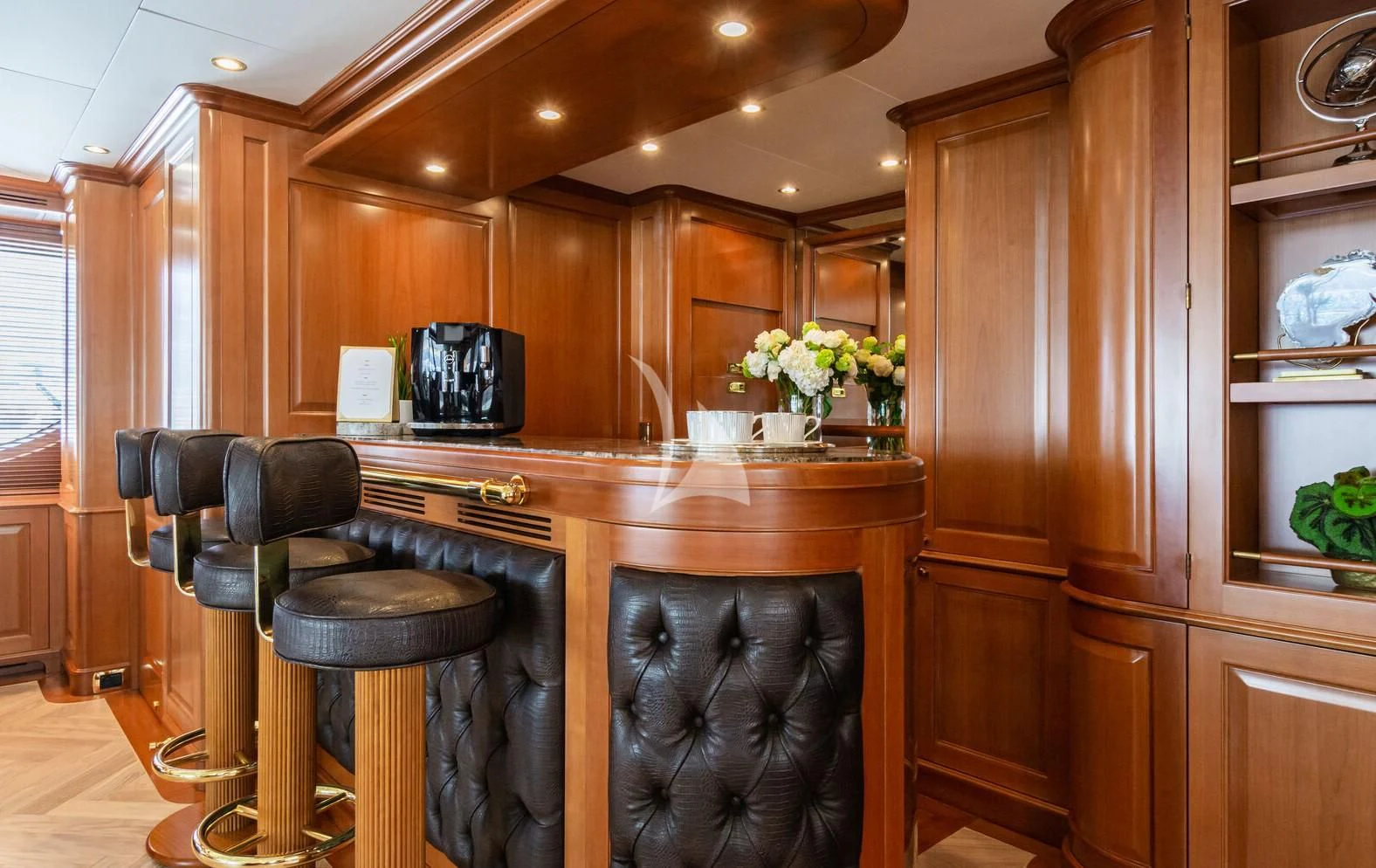 a kitchen with a bar stool aboard GIORGIA I Yacht for Sale