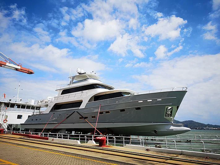 a large cruise ship docked aboard ICE Yacht for Sale