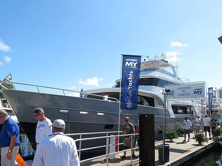 people standing outside a building aboard ICE Yacht for Sale