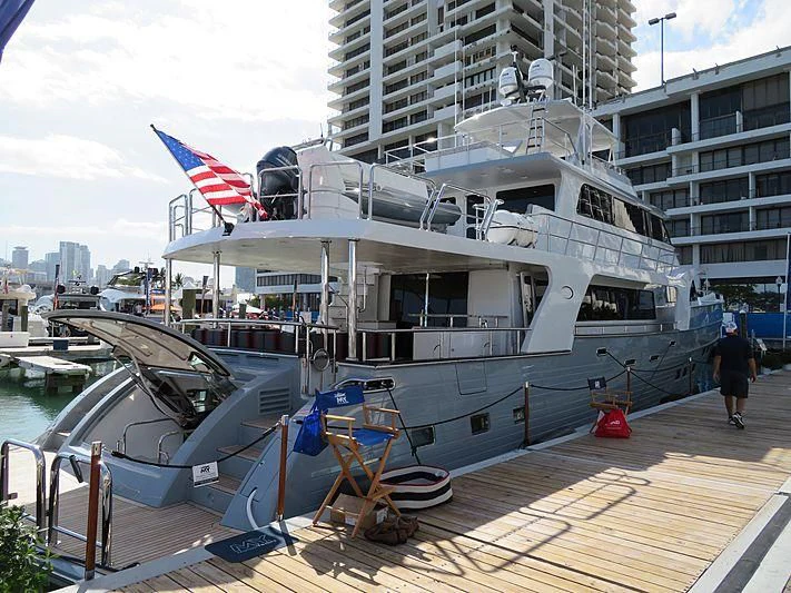 a boat docked at a pier aboard ICE Yacht for Sale
