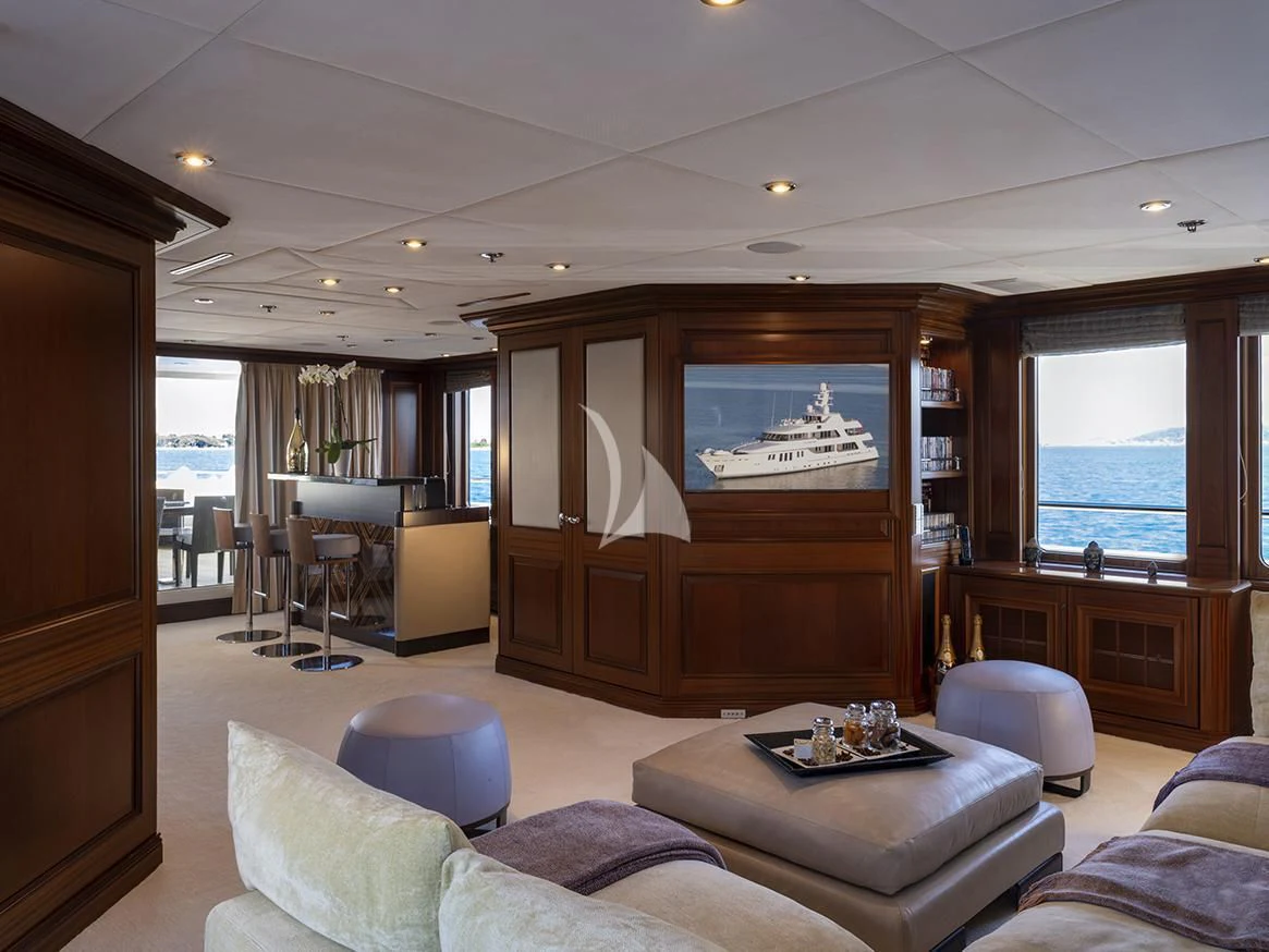 a living room with a fireplace aboard MY LITTLE VIOLET Yacht for Sale