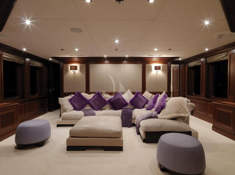 a large living room with a large mirror aboard MY LITTLE VIOLET Yacht for Sale