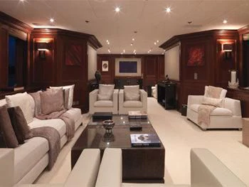 a living room with a table and chairs aboard MY LITTLE VIOLET Yacht for Sale