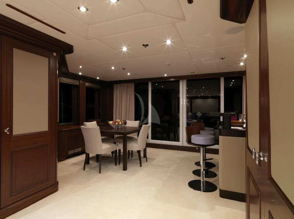 a room with a table and chairs aboard MY LITTLE VIOLET Yacht for Sale