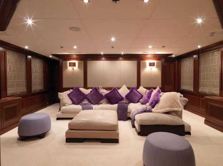 a room with a couch and a table aboard MY LITTLE VIOLET Yacht for Sale