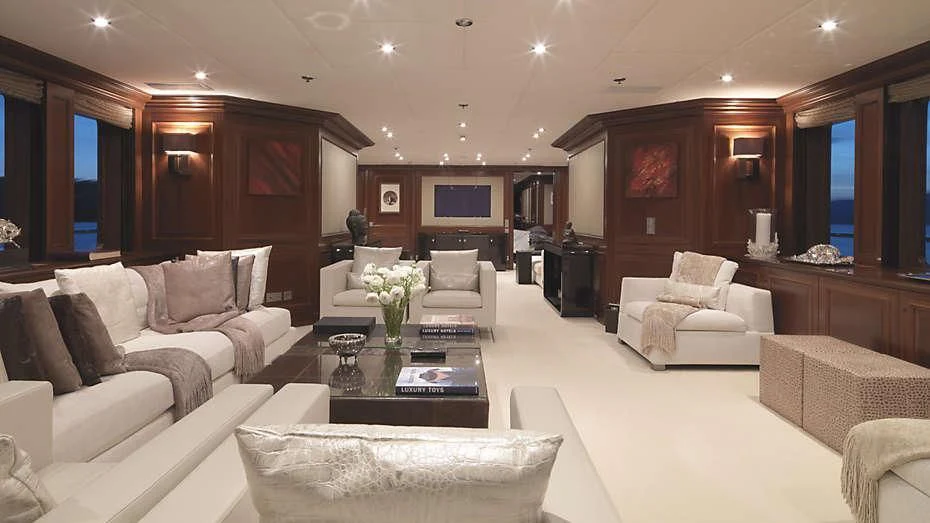 a living room with a white couch and a coffee table aboard MY LITTLE VIOLET Yacht for Sale