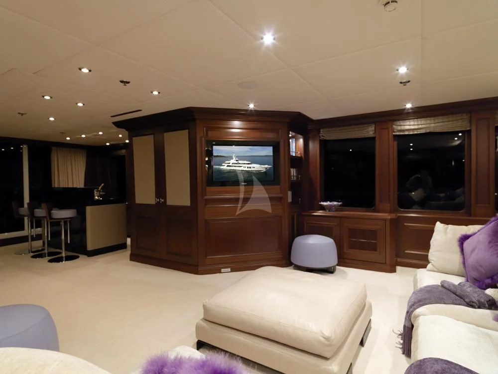 a living room with a large tv aboard MY LITTLE VIOLET Yacht for Sale