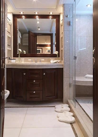 a bathroom with a large mirror aboard MY LITTLE VIOLET Yacht for Sale