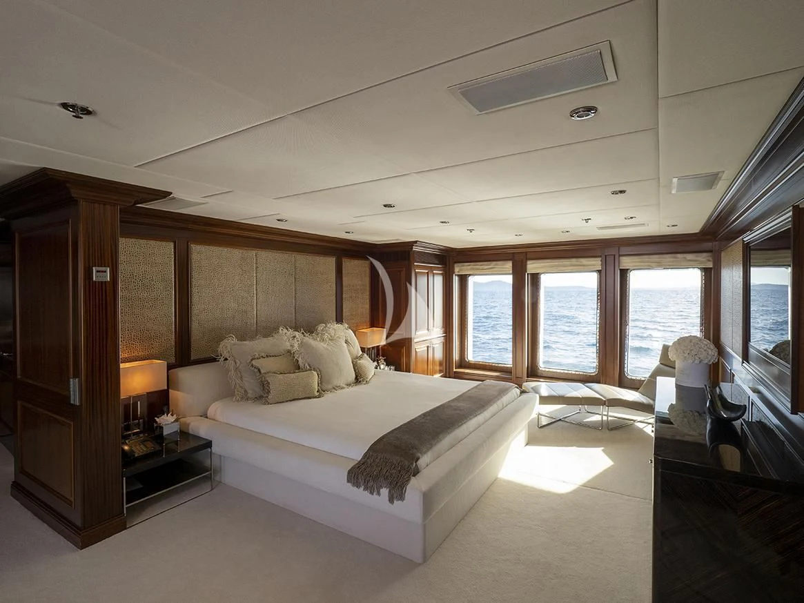 a large bedroom with a large window aboard MY LITTLE VIOLET Yacht for Sale