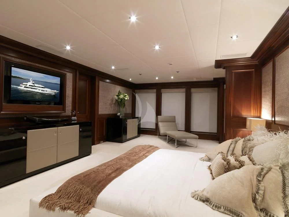 a large bedroom with a large tv aboard MY LITTLE VIOLET Yacht for Sale