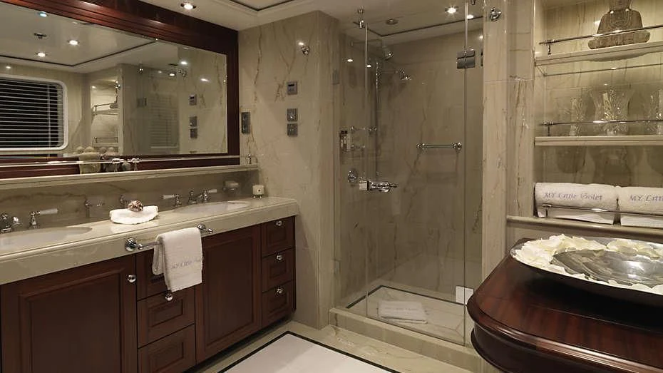 a bathroom with a shower and sink aboard MY LITTLE VIOLET Yacht for Sale