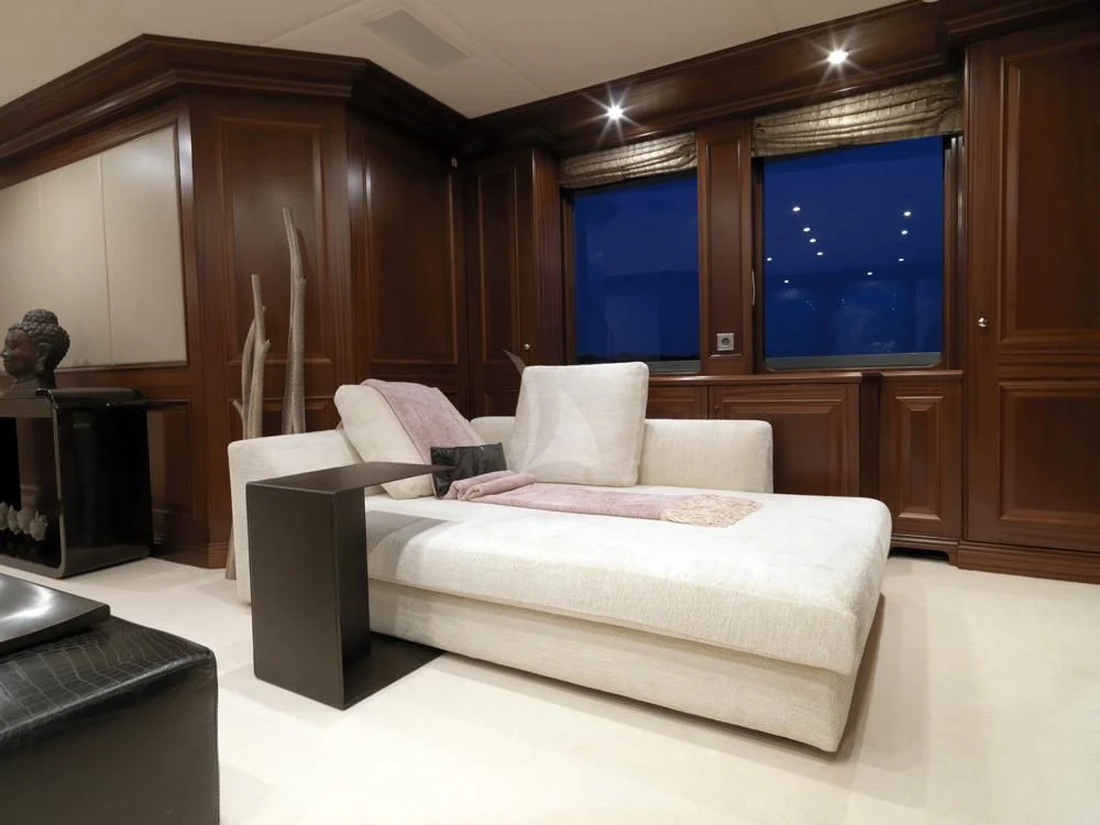 a white couch in a room aboard MY LITTLE VIOLET Yacht for Sale