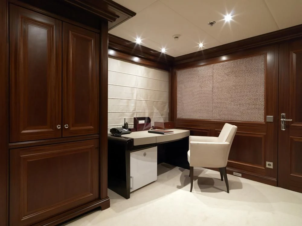 a kitchen with a white chair aboard MY LITTLE VIOLET Yacht for Sale