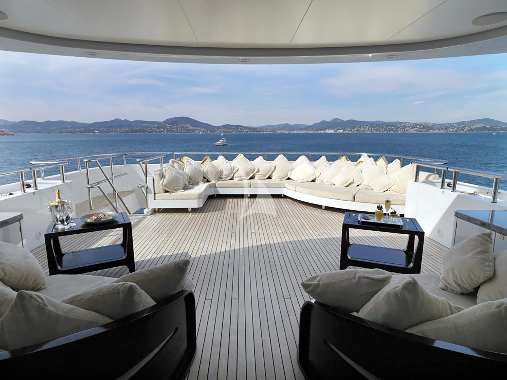 a room with a view of the ocean and a large cruise ship aboard MY LITTLE VIOLET Yacht for Sale