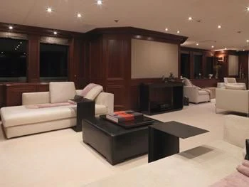 a living room with a couch and a coffee table aboard MY LITTLE VIOLET Yacht for Sale