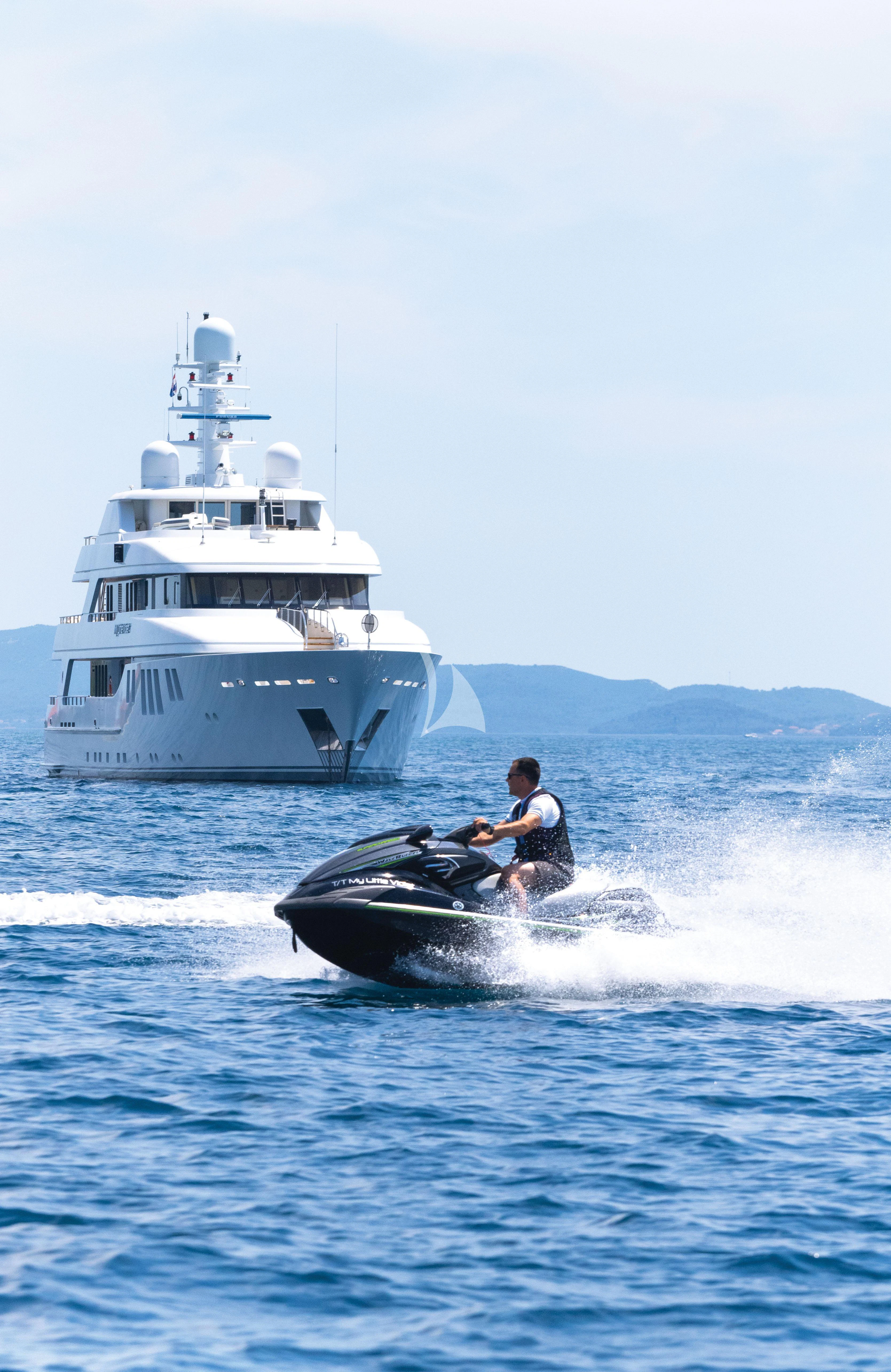 a man on a boat in the water aboard MY LITTLE VIOLET Yacht for Sale