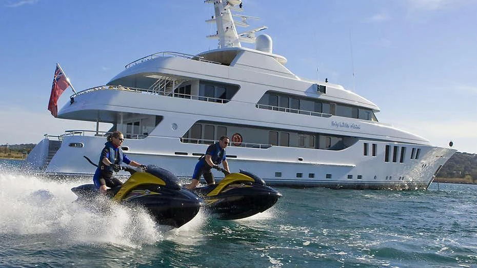 a couple of people on a speed boat in the water aboard MY LITTLE VIOLET Yacht for Sale