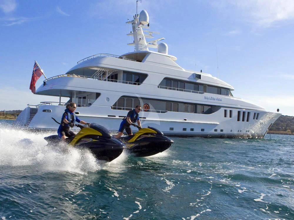 a boat with a couple of people on it aboard MY LITTLE VIOLET Yacht for Sale