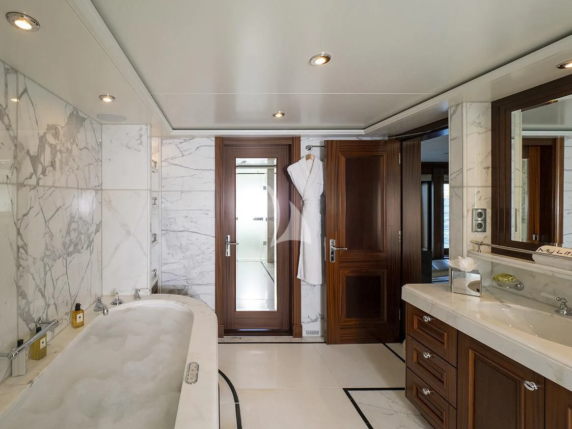 a bathroom with a bathtub and sink aboard MY LITTLE VIOLET Yacht for Sale