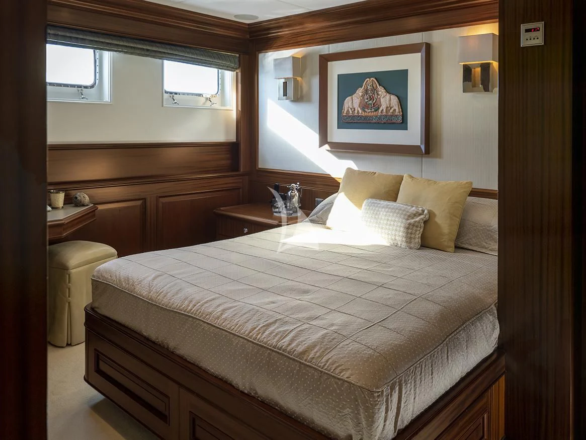 a bed with a white comforter aboard MY LITTLE VIOLET Yacht for Sale