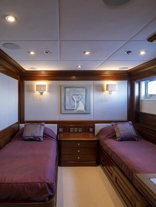 a room with a couple beds aboard MY LITTLE VIOLET Yacht for Sale