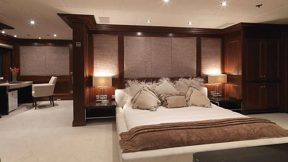 a large bed in a room aboard MY LITTLE VIOLET Yacht for Sale